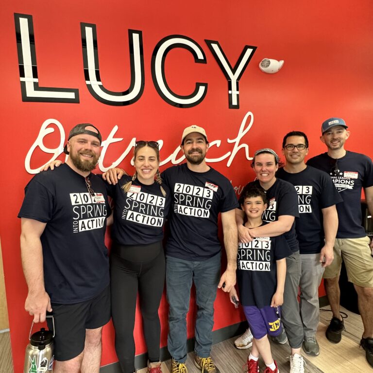 LUCY-group-w-sign