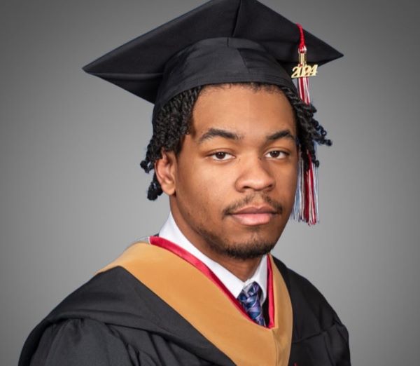 college grad headshot in cap and gown