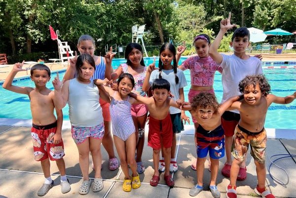 Group photo of children at a swimming pool